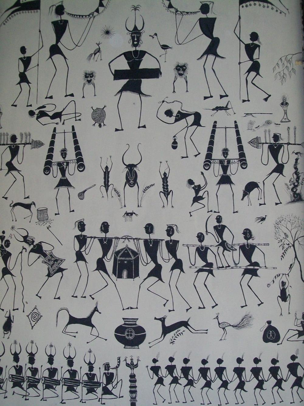 Mandana painting depicting wedding celebrations, white khadiya-paste linework on an ochre background