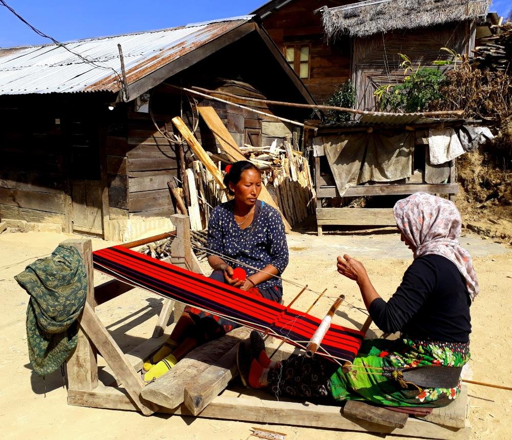 Two women weaving a traditional Naga shawl of the Yimchunger tribe